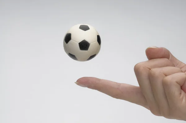 Soccer ball with female hand — Stock Photo, Image