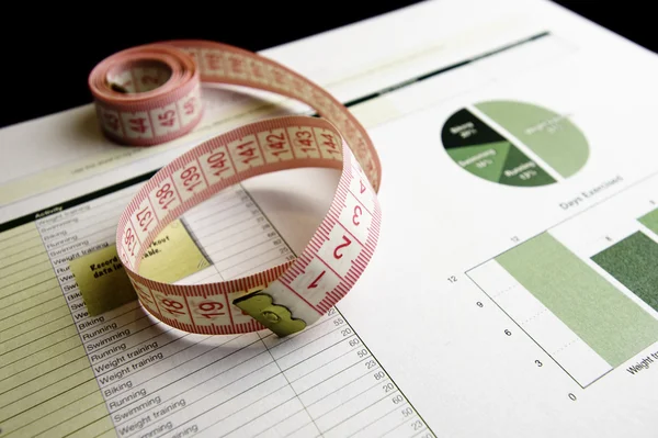 Training workout, calculation paper and tape measure — Stock Photo, Image