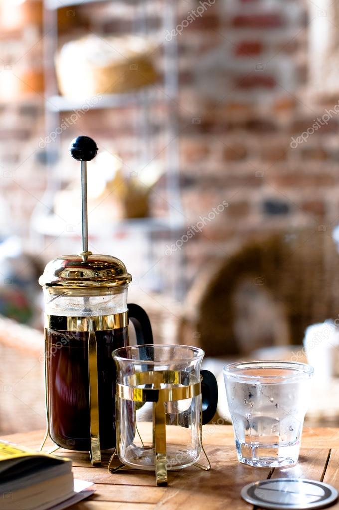 French press coffee and glass of water