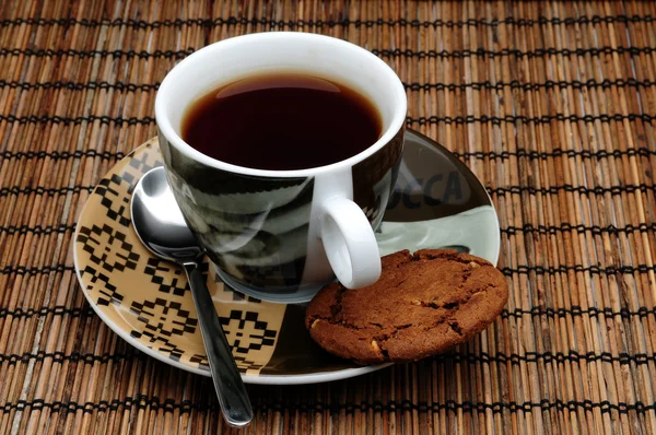 Cup of tea and a cookie — Stock Photo, Image