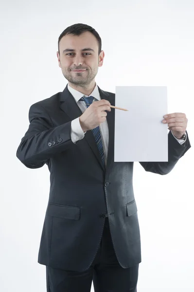 Businessman shows blank paper — Stock Photo, Image