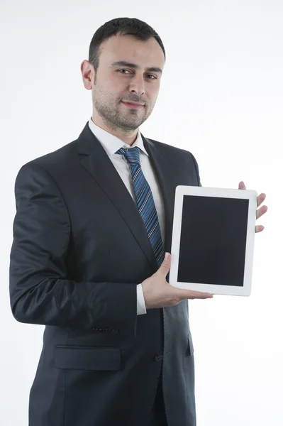 Empresário mostra tablet — Fotografia de Stock