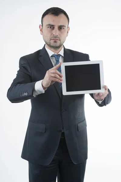 Businessman shows tablet — Stock Photo, Image