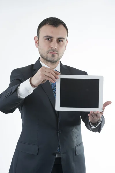 Businessman shows tablet — Stock Photo, Image