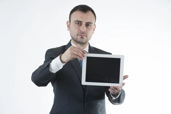 Businessman shows tablet — Stock Photo, Image
