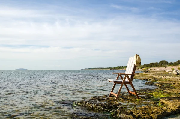 Chair by the coast — Stock Photo, Image