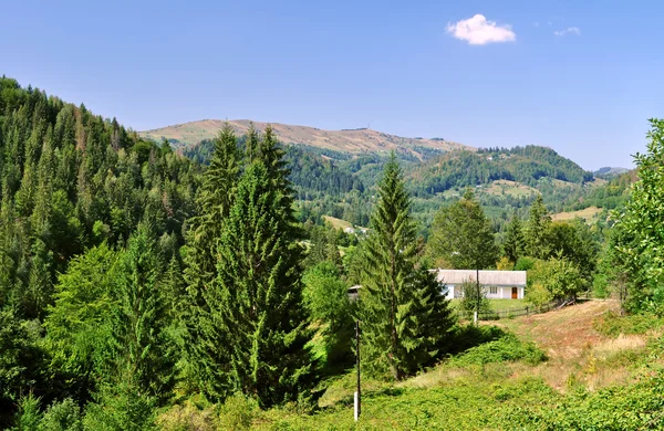 House in mountains — Stock Photo, Image