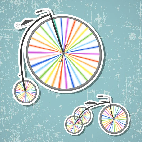 Bicicletas con ruedas de arco iris — Archivo Imágenes Vectoriales