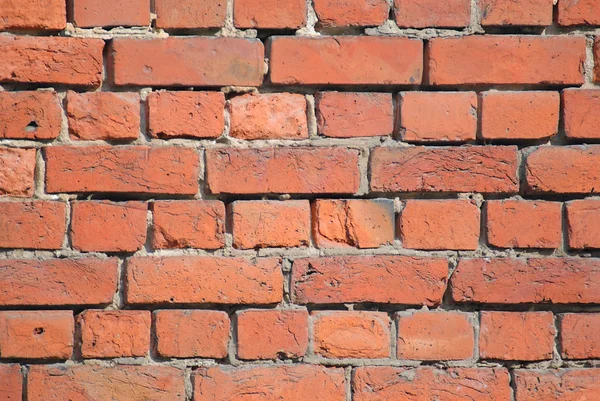 Muur van rode bakstenen. — Stockfoto