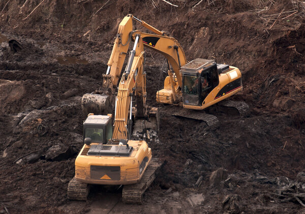 Excavators.
