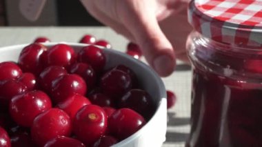 A Rotating Bowl With Red Fresh Ripe Cherries On The Background Of A White Brick Wall. High quality FullHD footage