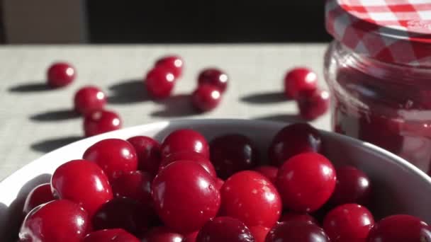 Rotating Bowl Red Fresh Ripe Cherries Background White Brick Wall — стоковое видео