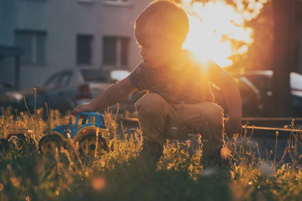 Child Playing Toys Little Boy Having Fun Playground Sunset Outdoor — Zdjęcie stockowe