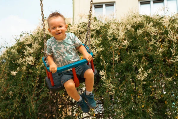 Swing Children Little Boy Having Fun Swing Playground Public Park —  Fotos de Stock