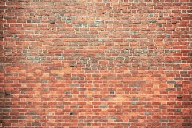 Brick wall background. Pattern brown color design decorative uneven cracked real stone wall surface with cement. Dry brick wall as seamless background.