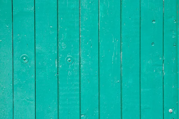 Wood background texture. Wooden surface, old boards, blue-green paint, blank retro template for advertising lettering, rough material, grungy textured background closeup