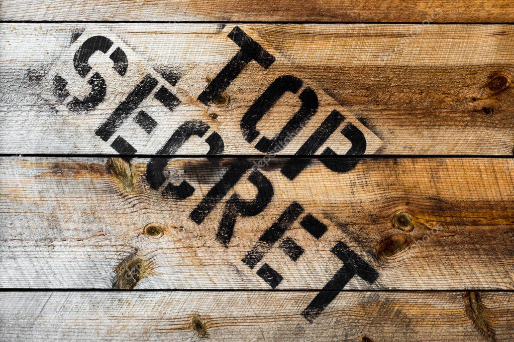 Top Secret stamp on wooden background or wooden box