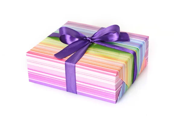 Gift with purple ribbon — Stock Photo, Image