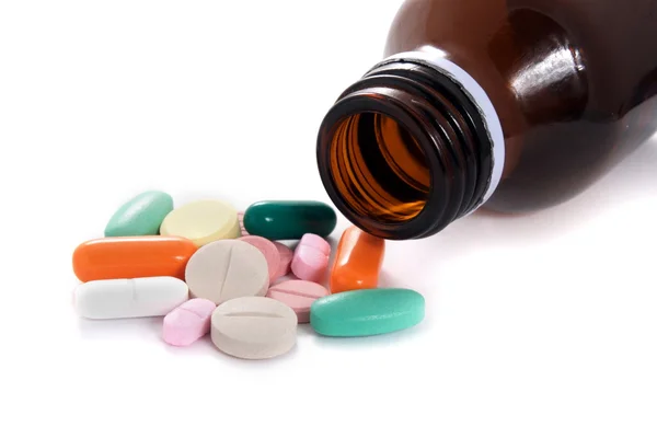 Various pills and the bottle — Stock Photo, Image