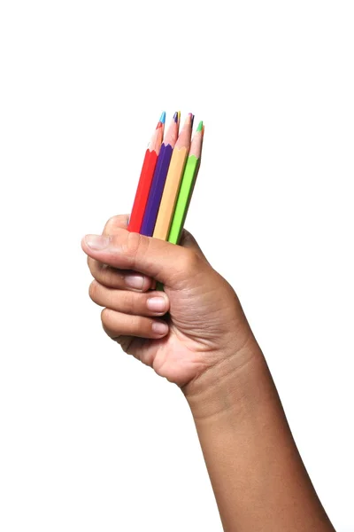 Mãos de criança segurando lápis de cor — Fotografia de Stock