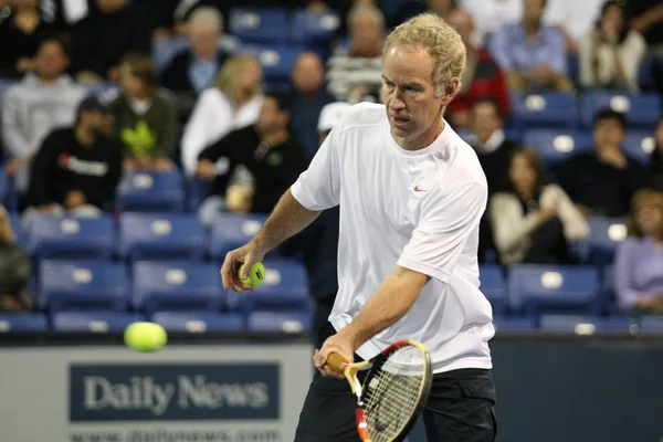 Andre Agassi and John McEnroe play a charity match — Stock Photo, Image