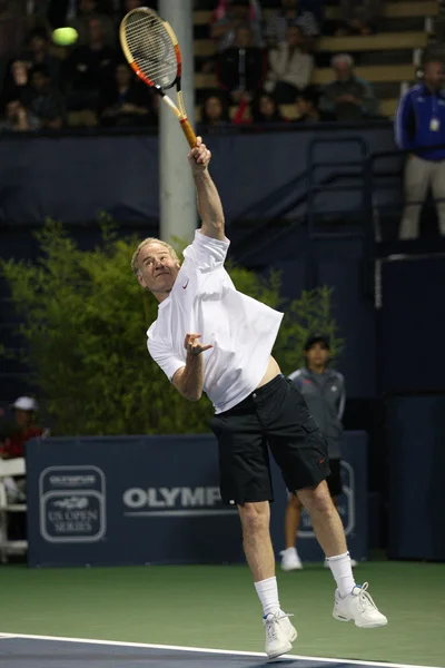 Andre Agassi and John McEnroe play a charity match — Stock Photo, Image