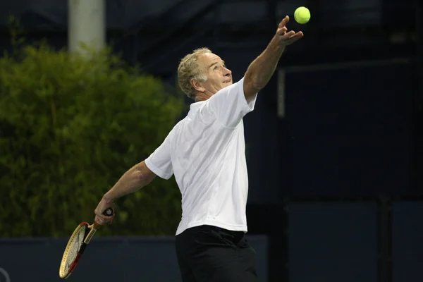 Andre Agassi and John McEnroe play a charity match — Stock Photo, Image