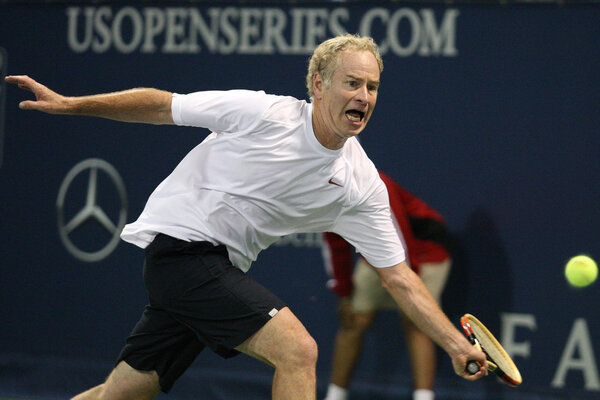 Andre Agassi and John McEnroe play a charity match