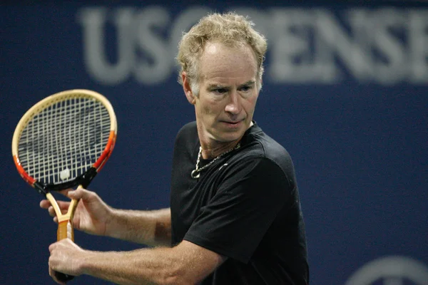 Andre Agassi and John McEnroe play a charity match — Stock Photo, Image