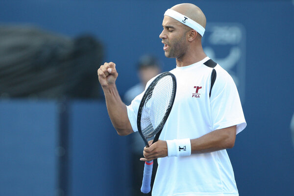 Benjamin Becker and James Blake play a match