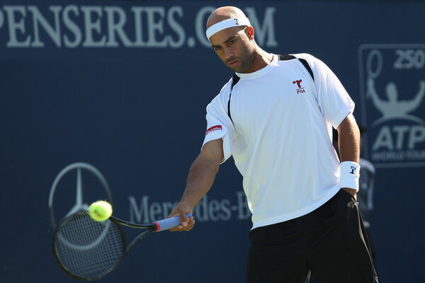 Benjamin Becker and James Blake play a match