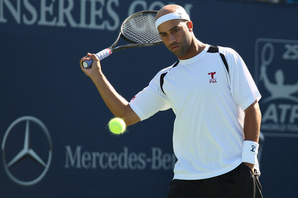 Benjamin Becker and James Blake play a match