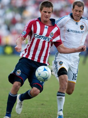 Justin Braun (L) ve Gregg Berhalter (R) eylem sırasında Mls Konferansı yarı final maç