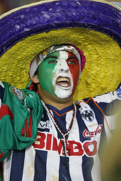 A Mexico fan with a painted face cheers his team to victory — Stock Photo, Image