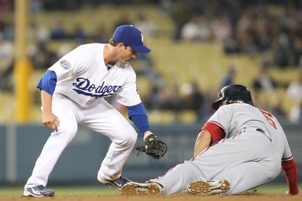 Ryan Theriot puts a late tag on Ian Desmond during the game — Stock Photo, Image