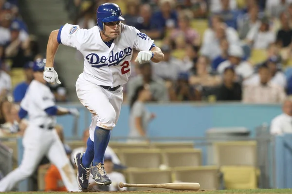 Scott podsednik tar av mot första efter hitting en djup flyger bollen som gick foul under spelet — Stockfoto