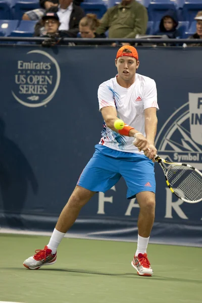 Jack Sock backhands a return to Flavio Cipolla during the tennis match — Stock Photo, Image