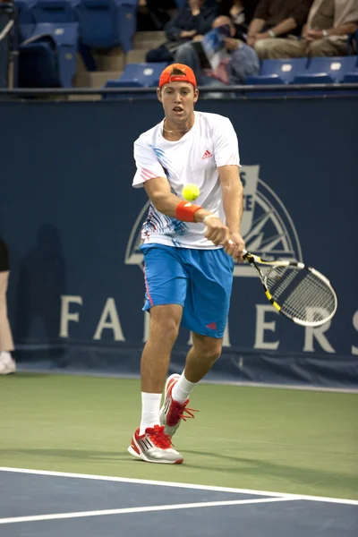 Jack Sock backhands a return to Flavio Cipolla during the tennis match — Stock Photo, Image