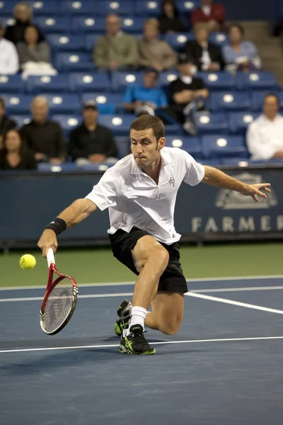 Flavio Cipolla backhands his return to Jack Sock during the tennis match — Stock Photo, Image