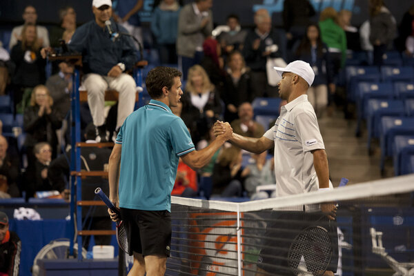 Tobias Kamkeand James Blake shake hands at the end of the match