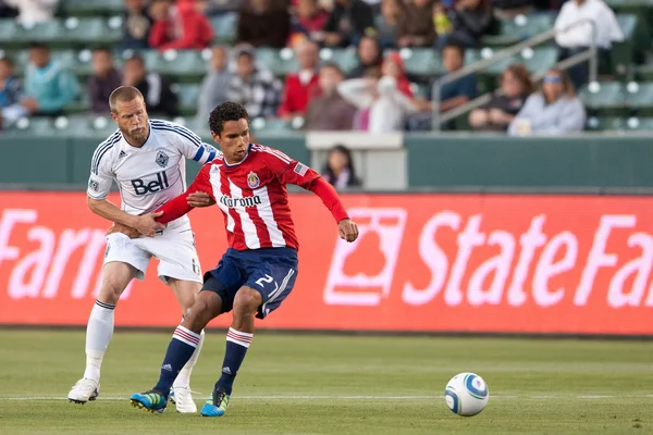 Chris Cortez gets held up by Jay DeMerit during the game — Stock Photo, Image