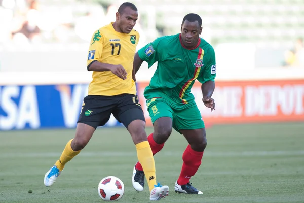 Rodolph austin en delroy facey in actie tijdens het spel — Stockfoto