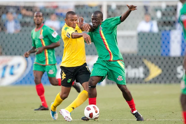 Rodolph Austin and Patrick Modeste in action during the game