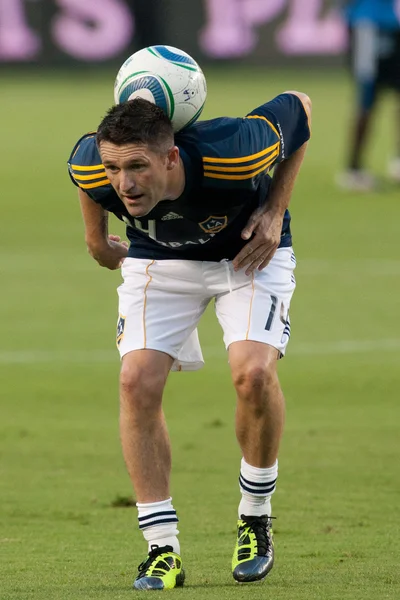 Robbie keane ogrzewa się przed meczem — Zdjęcie stockowe