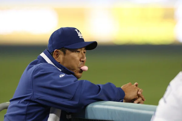 HIROKI KURODA watches the game unfold from the dugout during the game — Stock Photo, Image