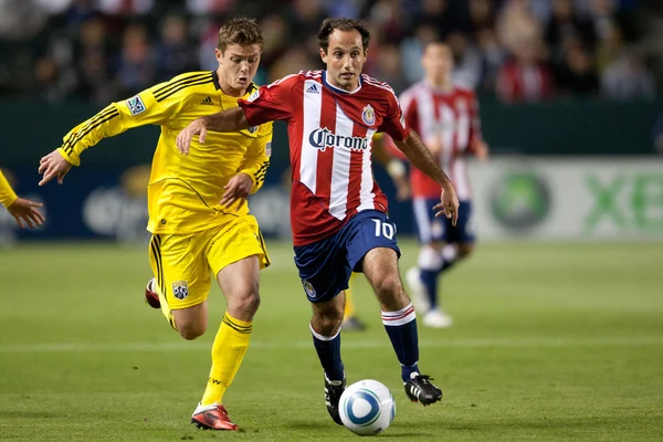 Nick La Brocca and Robbie Rogers fight for the ball during the Major League Soccer game — Stock Photo, Image