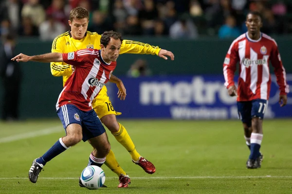 Nick La Brocca and Robbie Rogers fight for the ball during the Major League Soccer game — Stock Photo, Image