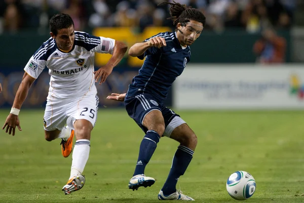 Miguel Lopez and Stephane Auvray fight for the ball during the game — Stock Photo, Image