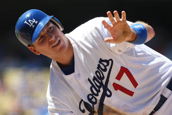A.J. ELLIS dives back to first to avoid being picked off and looks up if he is safe during the game — Stock Photo, Image