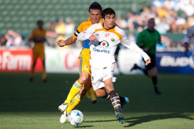 Ezequiel Orozco and Fernando Ortiz in action during the InterLiga 2010 match clipart